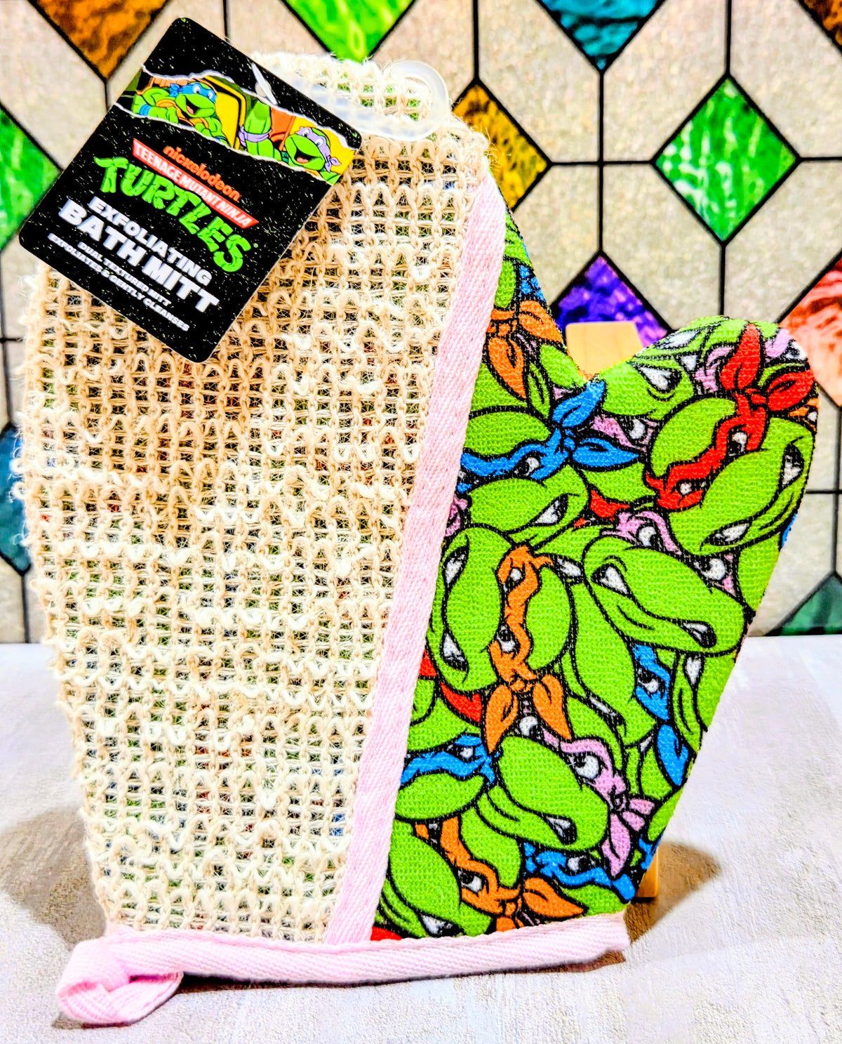 Teenage Mutant Ninja Turtles bath mitt in pink netting with green character print