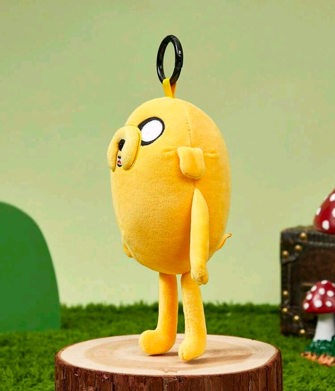 Yellow Jake the Dog plush bag charm keychain, side view with black keyring loop.
