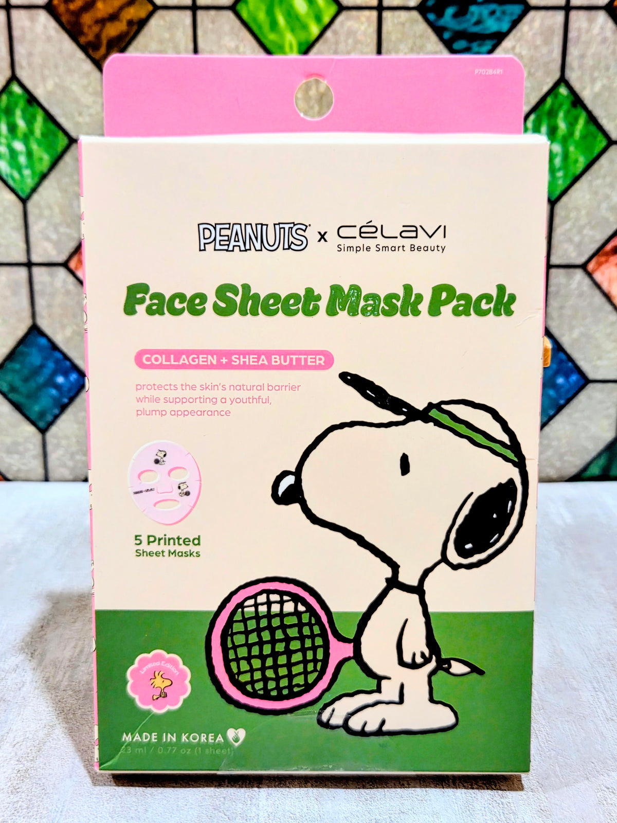 Snoopy Face Sheet Mask Pack front with 5 printed sheet masks and green net graphic