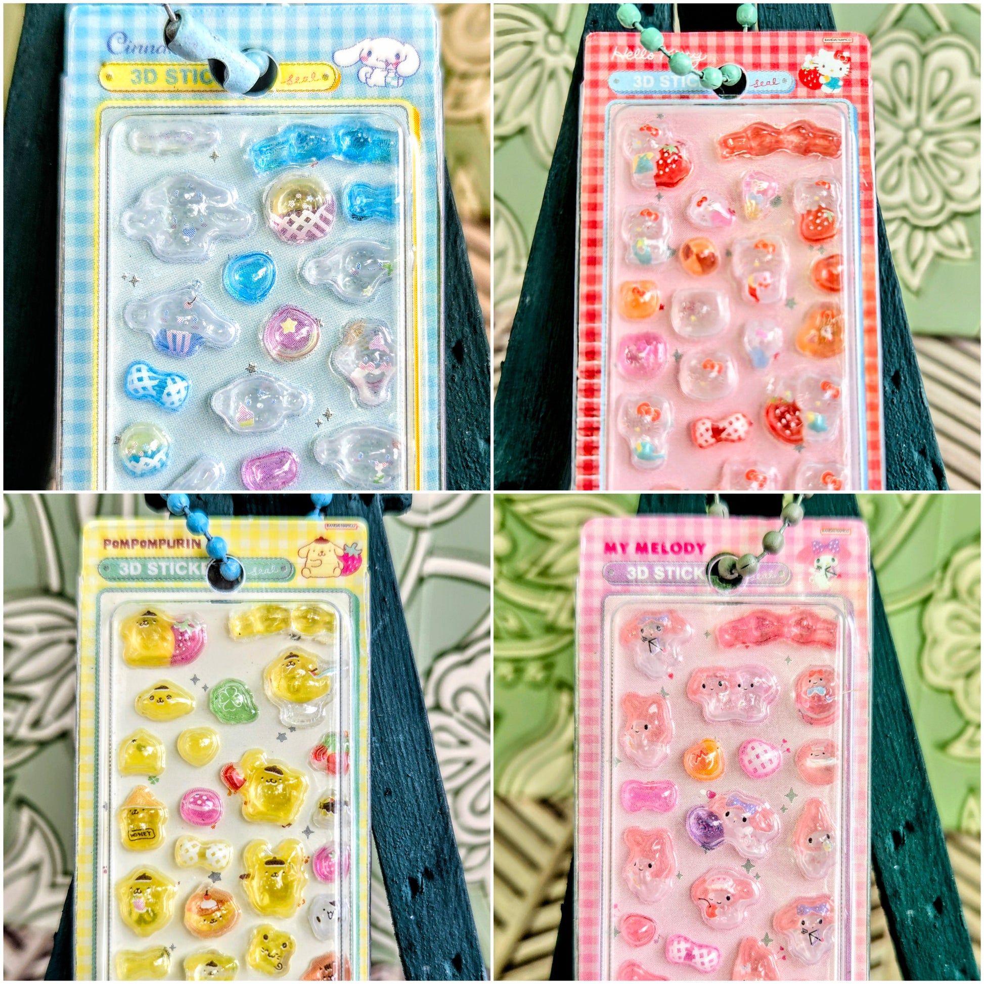 Four blister-pack 3D sticker keychains in blue, pink, yellow, and orange