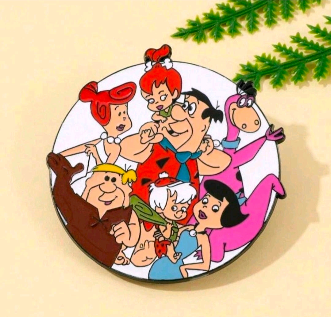 Round enamel pin brooch featuring The Flintstones family cartoon scene in bright enamel colors