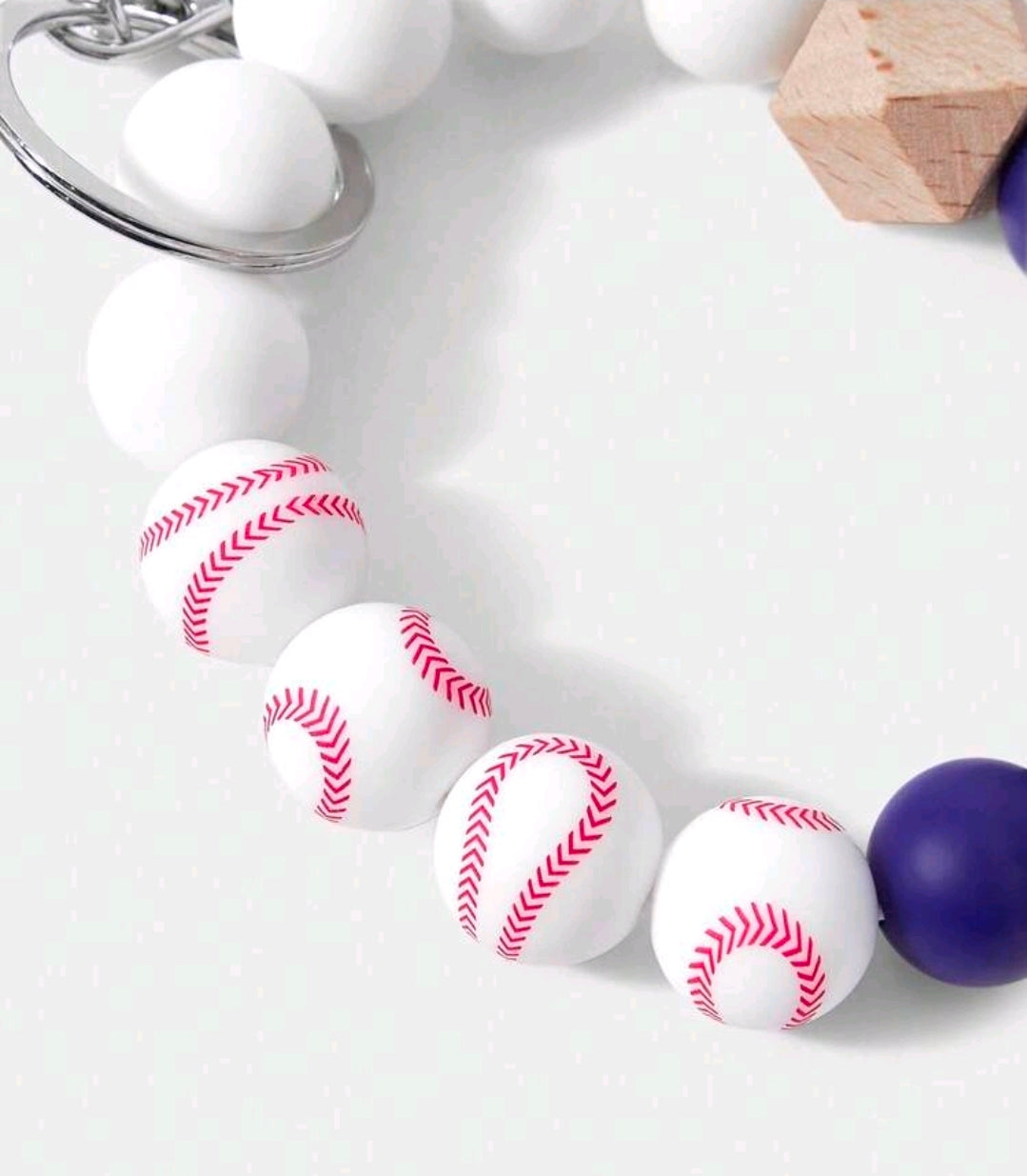 Beaded wrist strap keychain with white and navy beads and red-white baseball charms