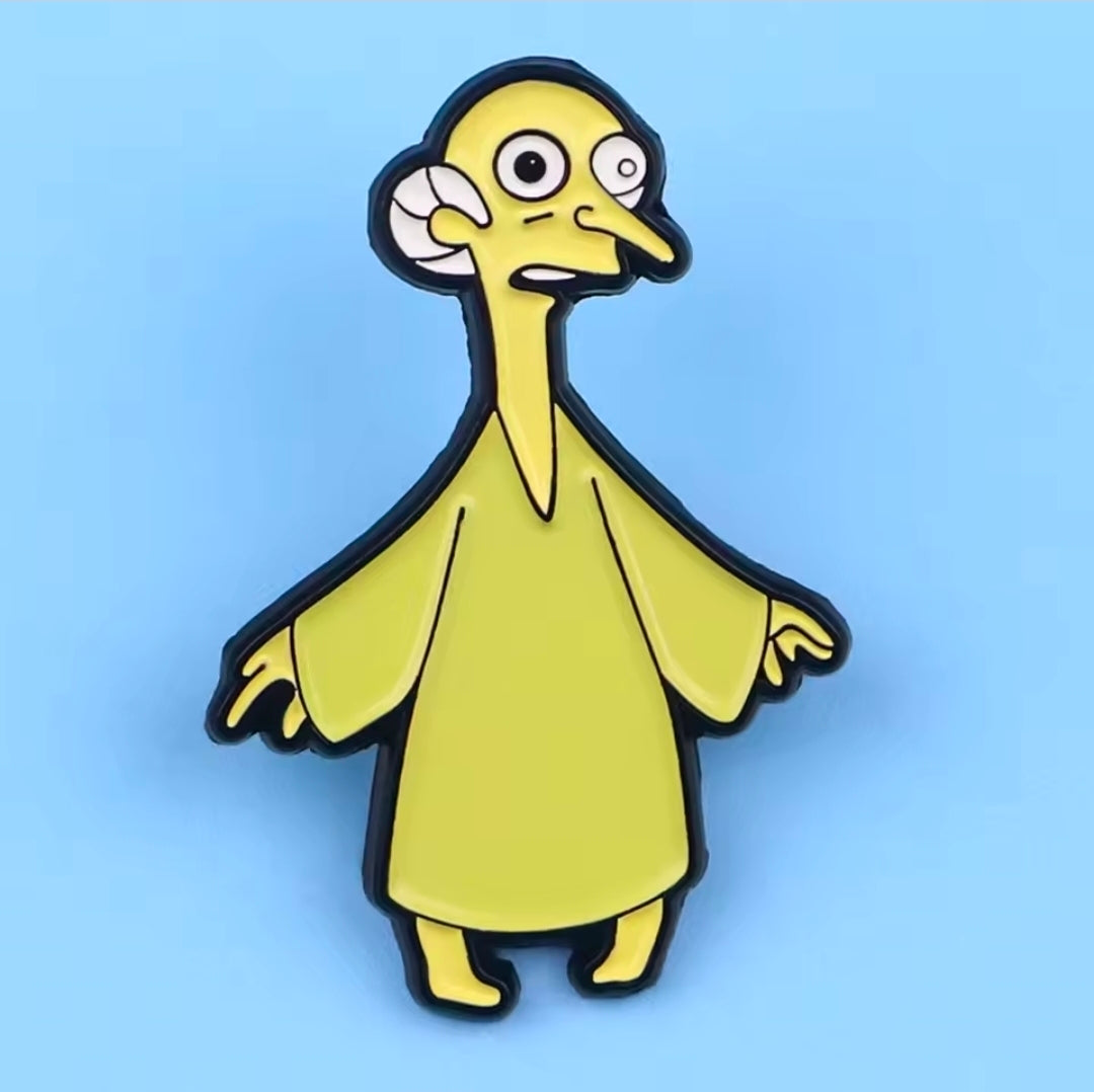 Enamel pin of Simpsons cat lady in yellow-green dress with black hair, standing