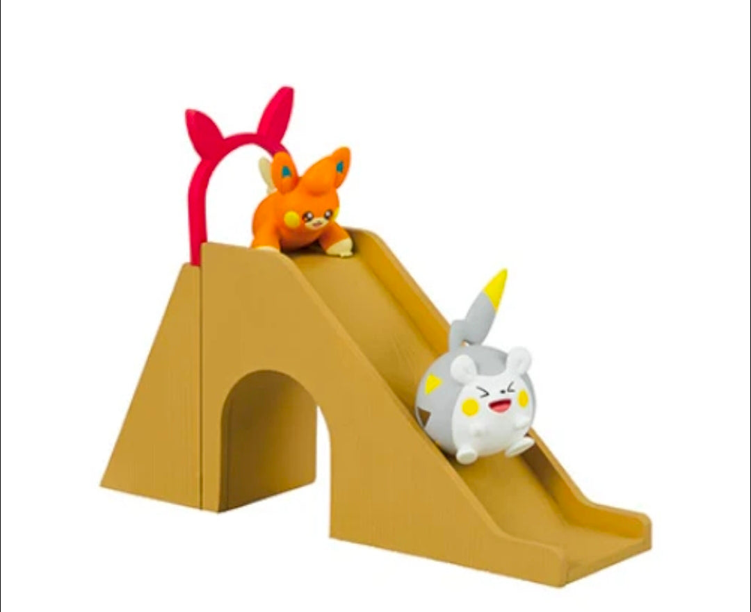 Pokemon mini figure slide playset with two animal figures on a tan slide