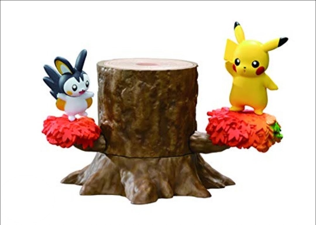 Yellow lightning mouse and blue rabbit-like figure on opposite sides of a brown tree-stump