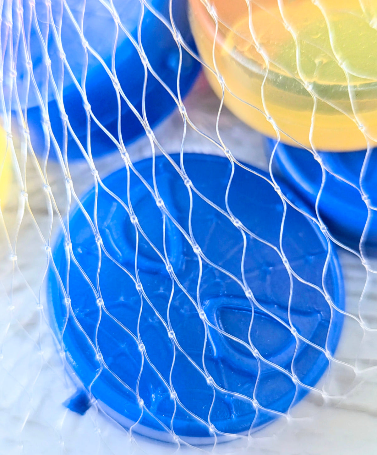 Blue Spider-Man ice cube mold tray with circular web-pattern cavities