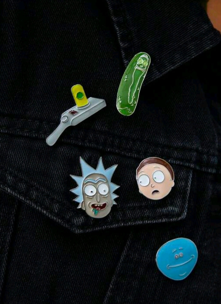 Enamel pins on denim jacket: portal gun, pickle Rick, Rick head, Meeseeks face, blue portal