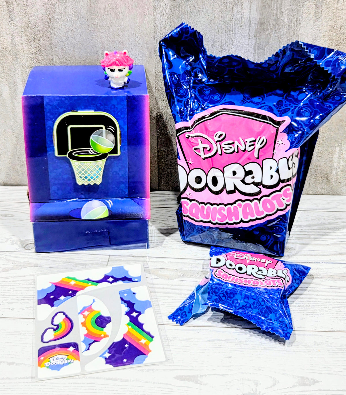 Arcade hoopz squish toy cube and blue unopened pack with Disney Doorables logo