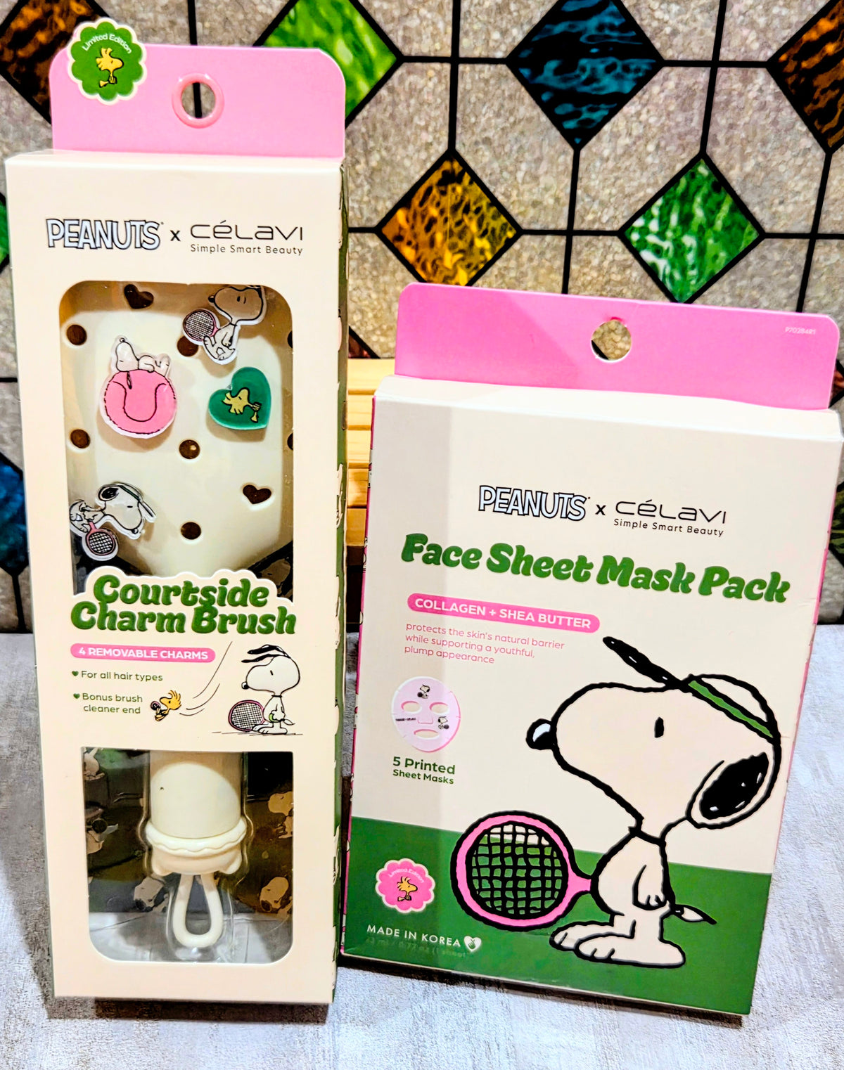 Snoopy face sheet mask pack and courtside charm brush gift set boxes together