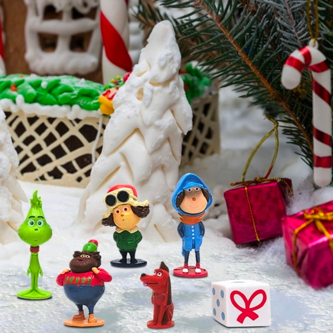 Grinch-themed mini figurines standing together, featuring green characters and small gift box