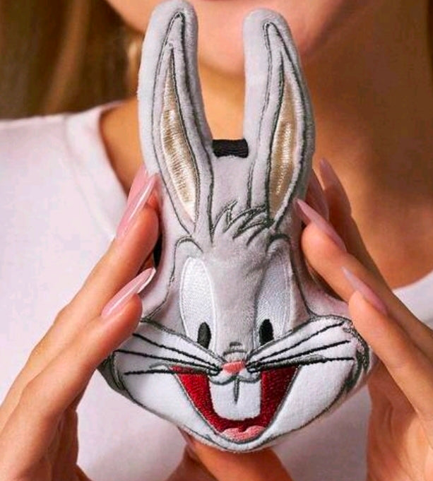 Gray plush rabbit face keychain charm held in hands, black loop and smiling face