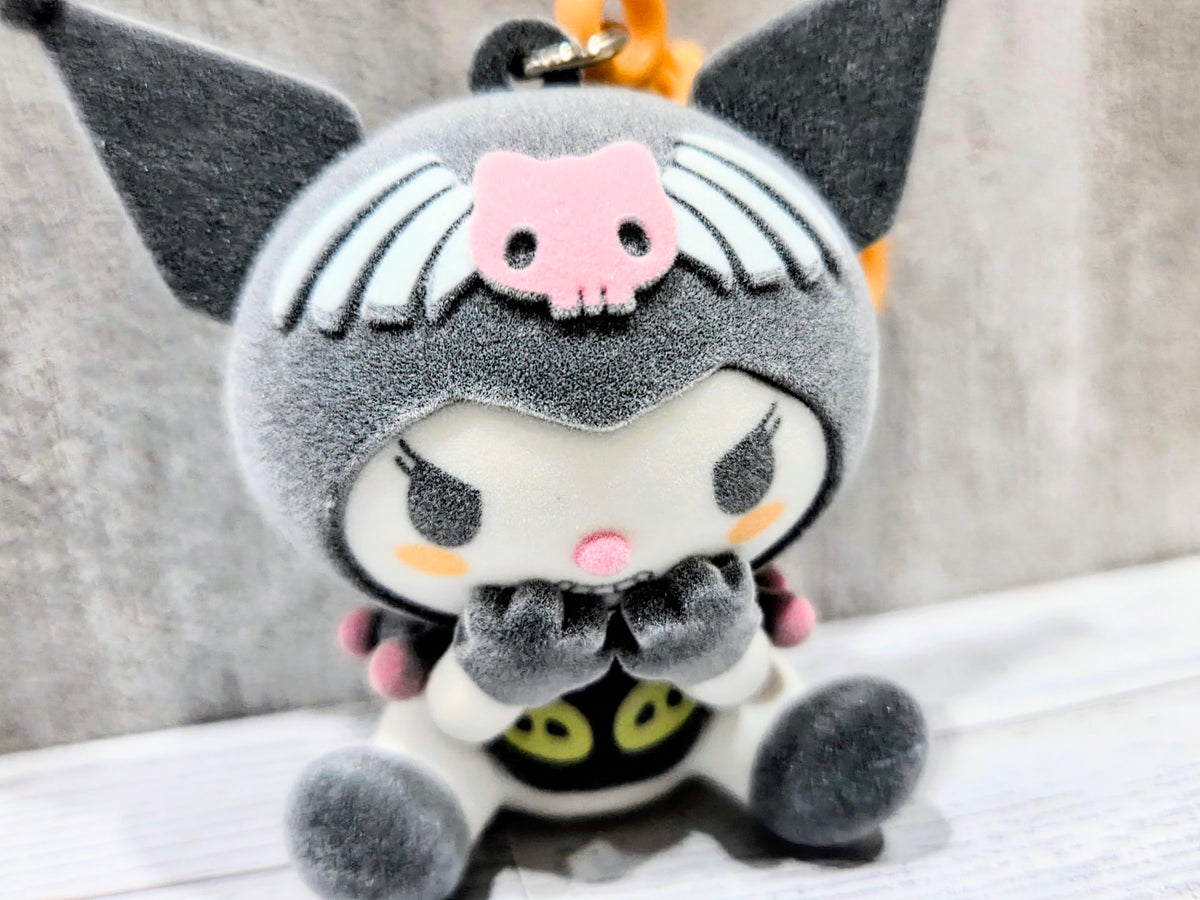 Gray flocked plush bag clip cat costume with pink bow face, black bat-wing ears, and orange loop