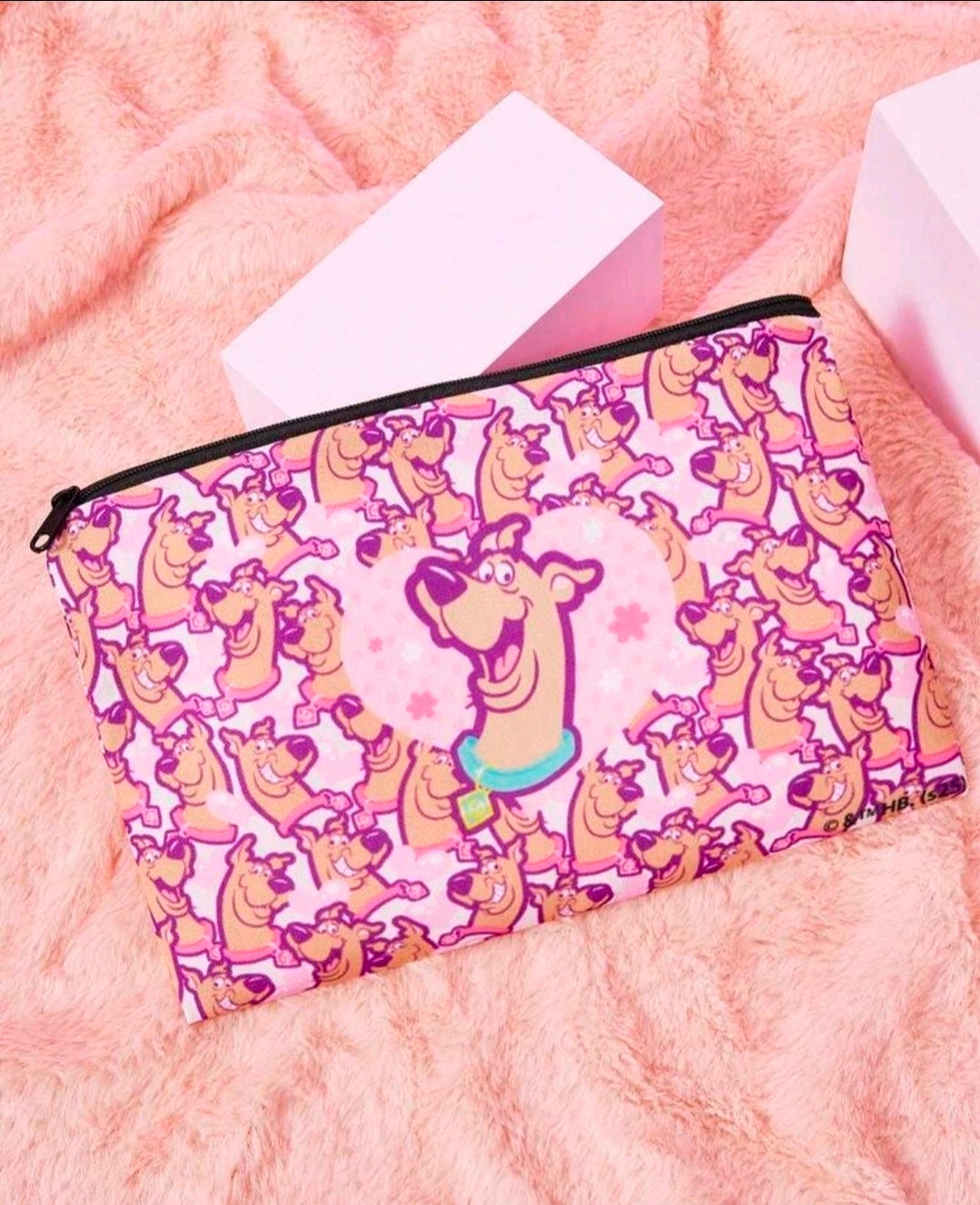 Pink Scooby-Doo makeup pouch with black zipper and character print
