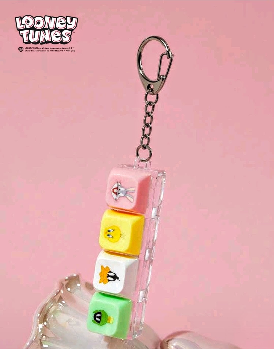 Looney Tunes clicker fidget keychain keycaps in pink, yellow, white, and green with chain ring