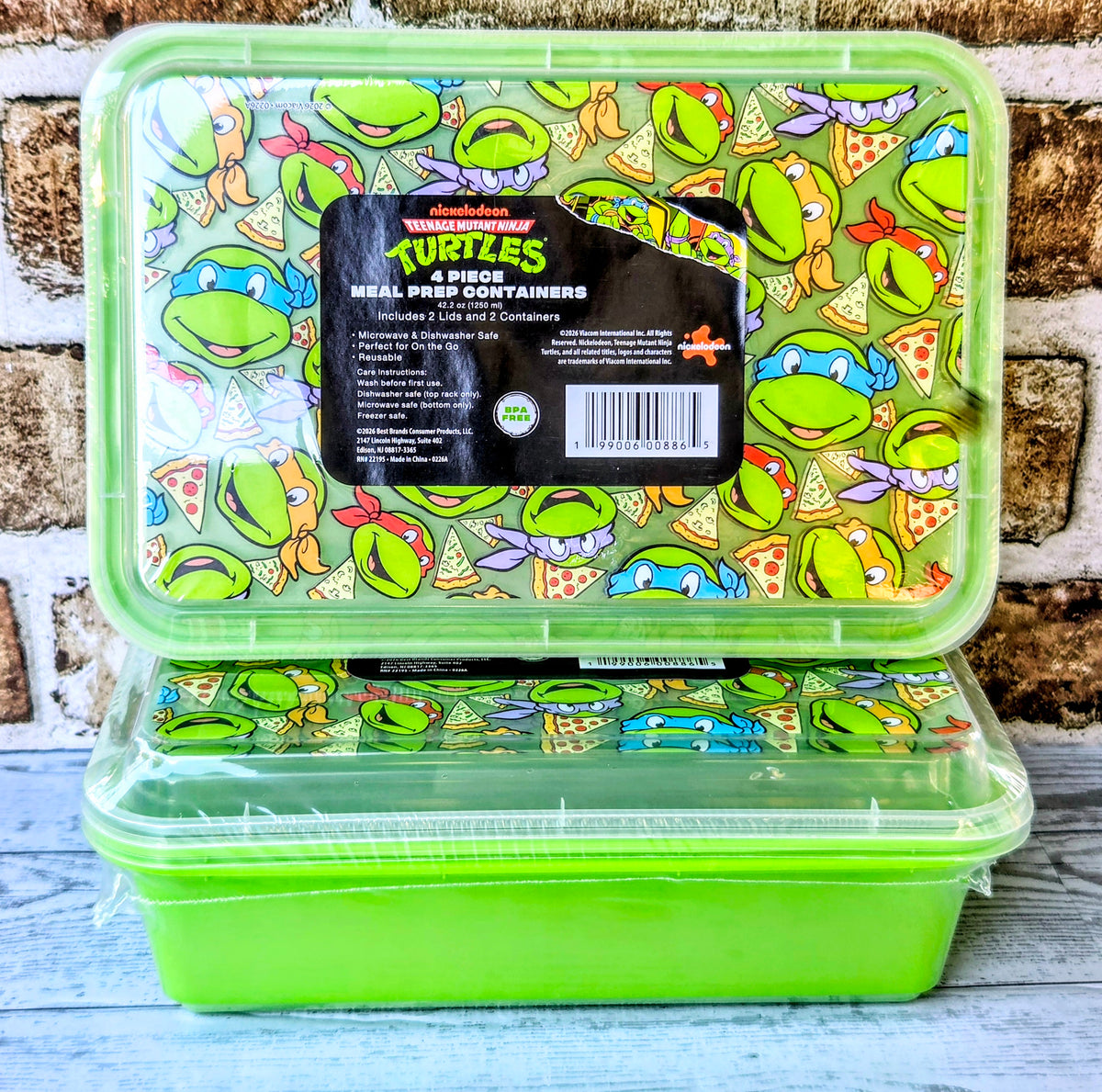 Two-compartment green meal prep containers with Teenage Mutant Ninja Turtles graphics
