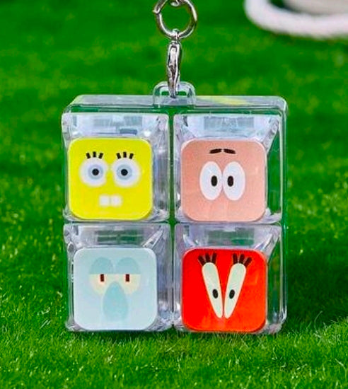Clear 2x2 SpongeBob fidget keychain charm with four character tiles and metal keyring