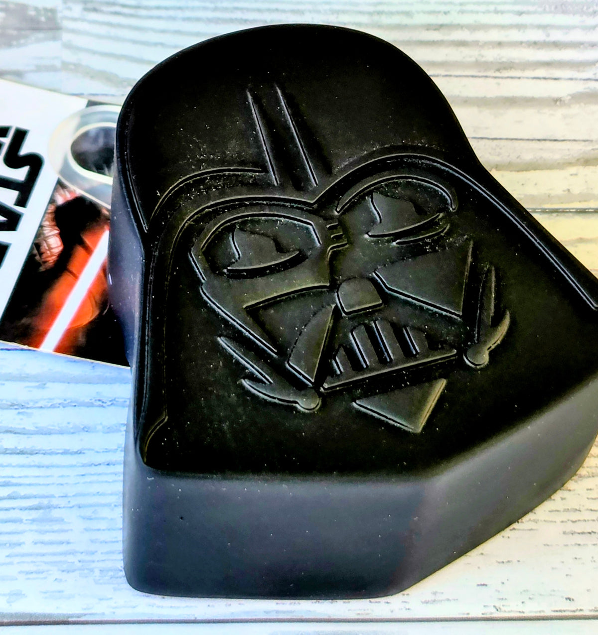Black Star Wars lint roller with Darth Vader embossed on front