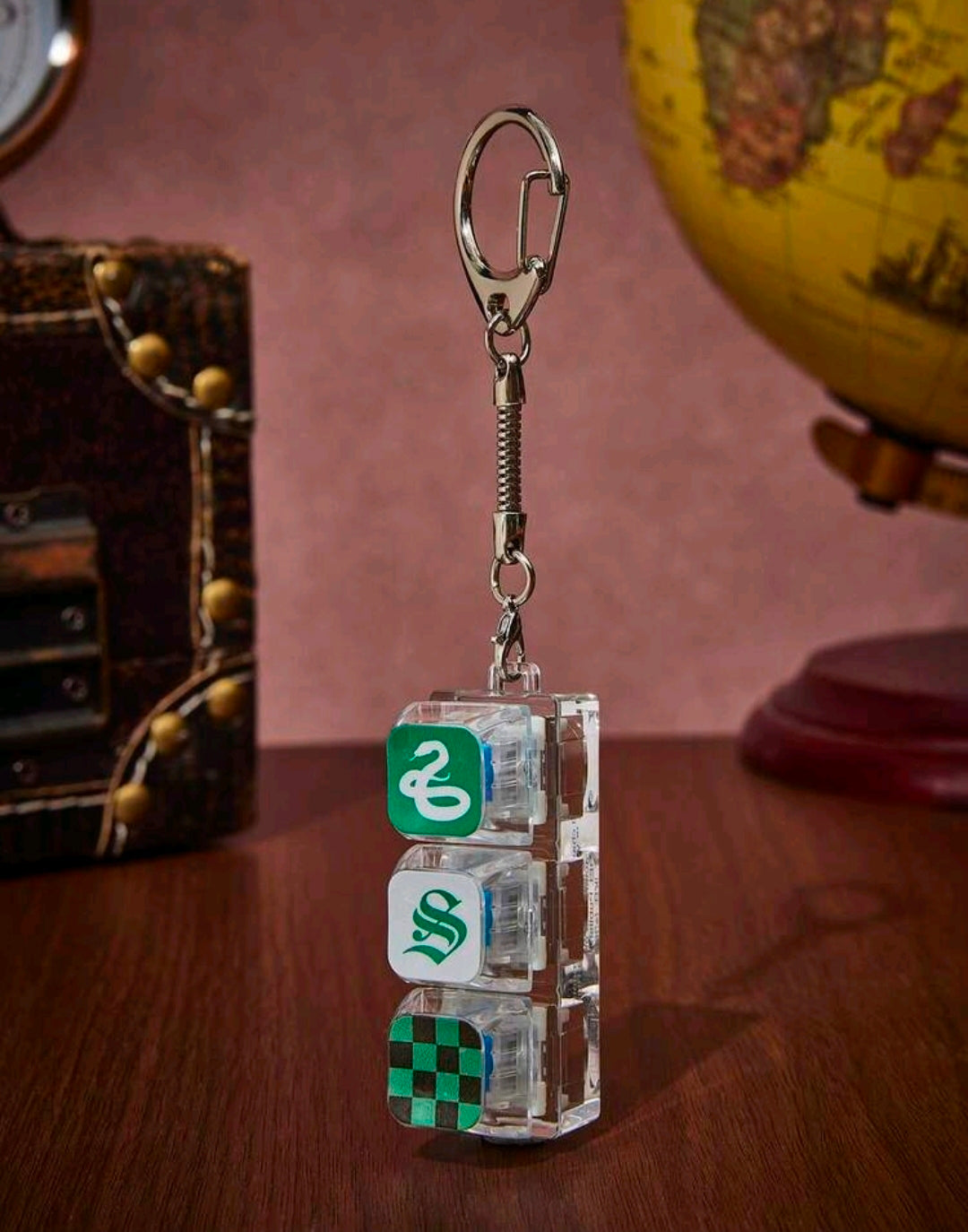 Slytherin fidget keychain charm, clear stacked blocks with green snake and checkerboard