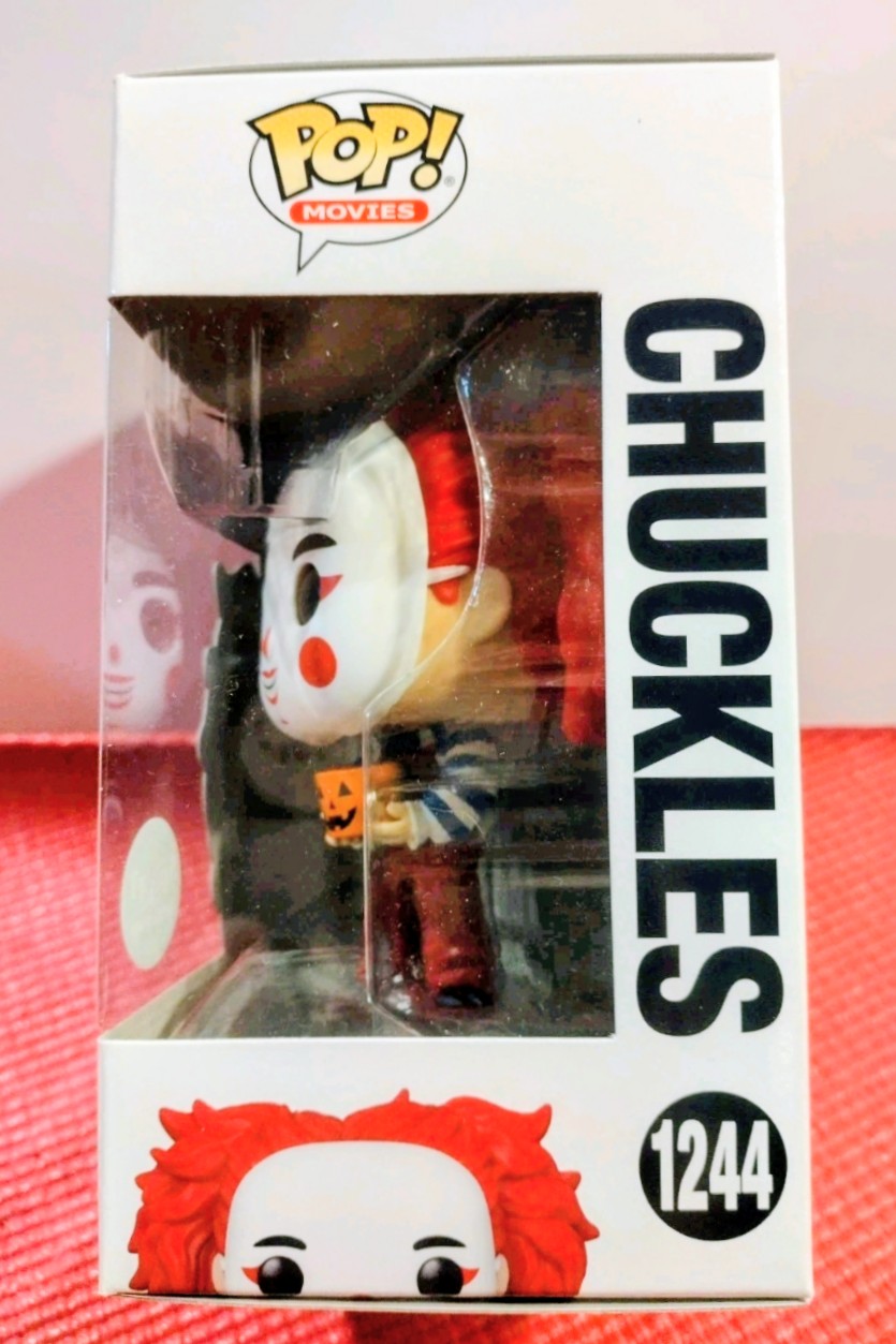 Chuckles Funko Pop! figure in box with side window, red hair and jack-o-lantern