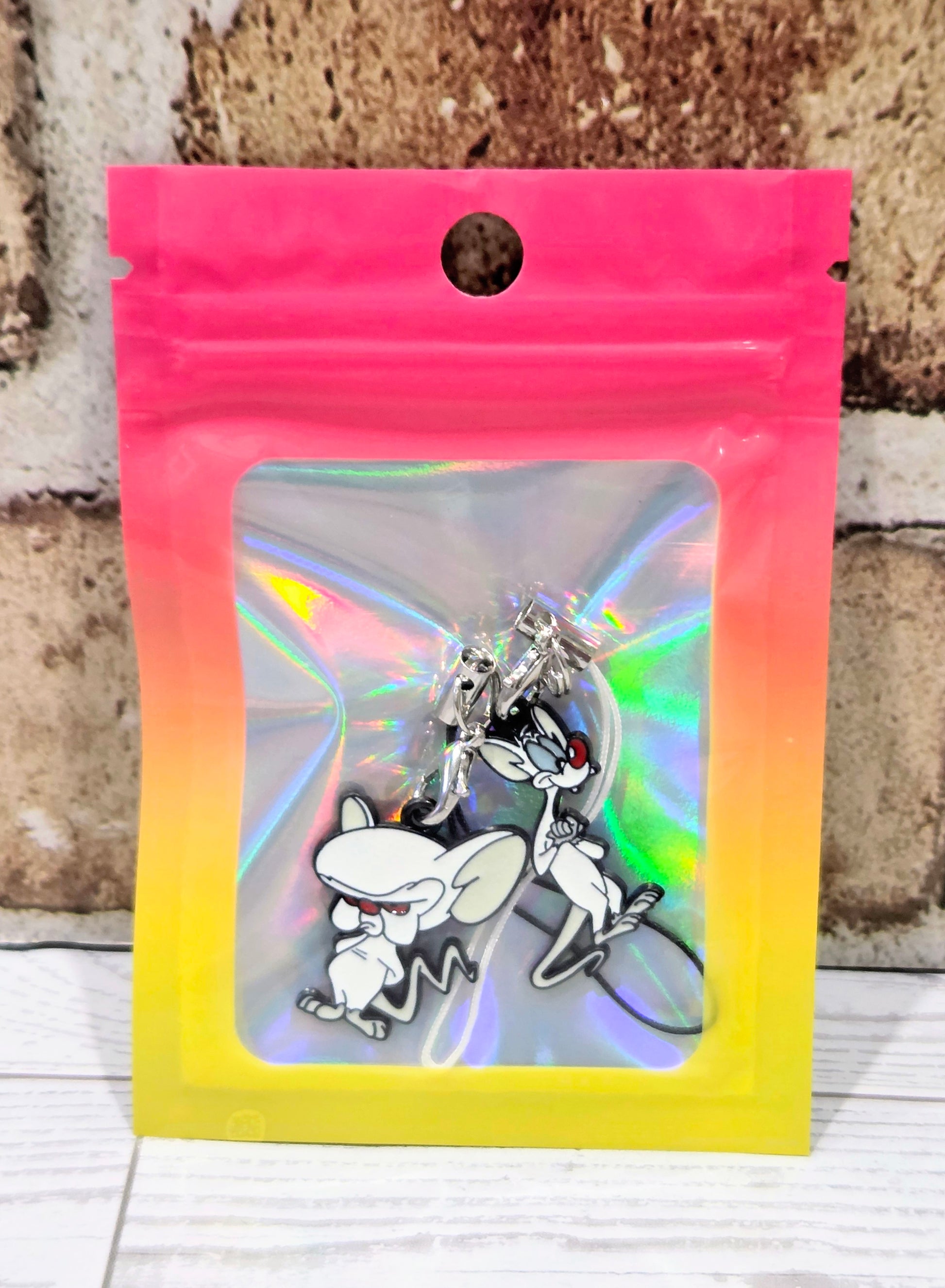 Sealed bag phone charm set with two cartoon mouse charms and silver clasps