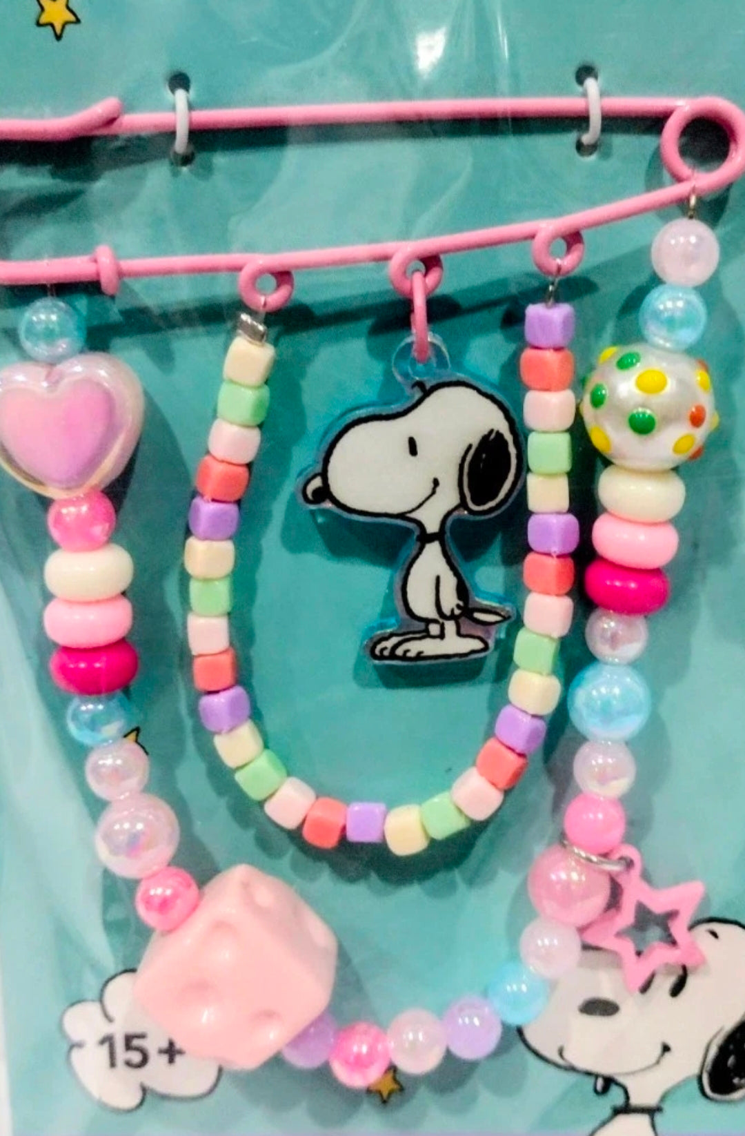 Snoopy beaded safety pin keychain with multicolor beads, heart charm, and star accents