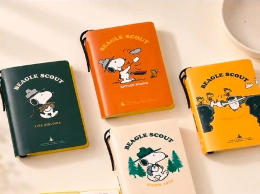 Faux leather pocket field notebooks with Beagle Scout cover art and pen loops in orange, yellow, and green