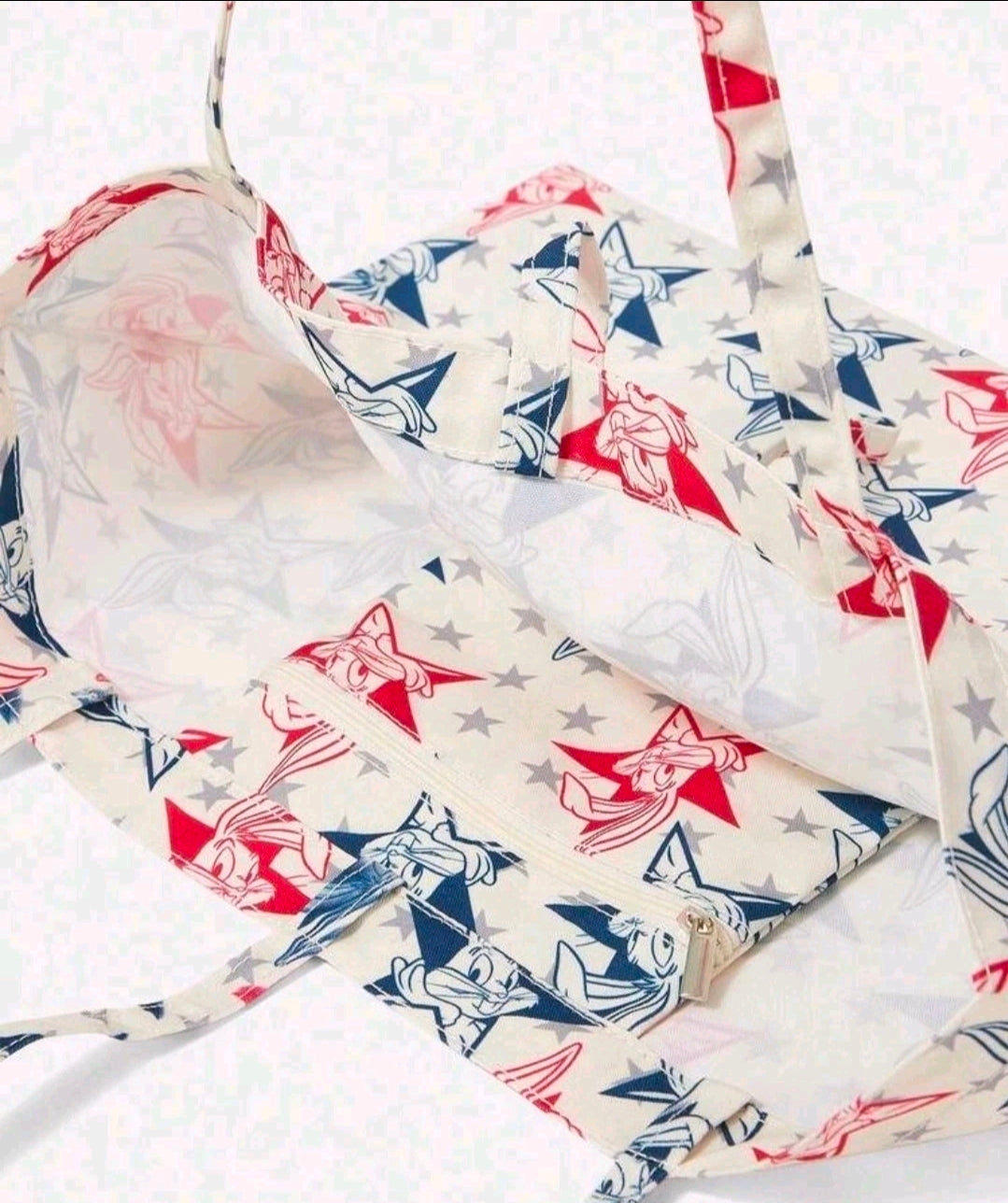 Star and cartoon bunny print tote bag with stitched seams and long carry handles