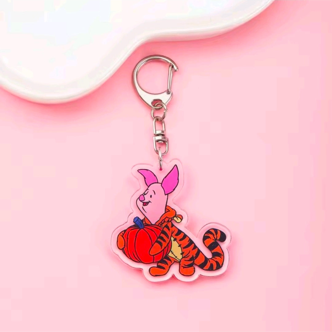 Acrylic Halloween keychain with carabiner; pink rabbit character in red-and-black costume charm.