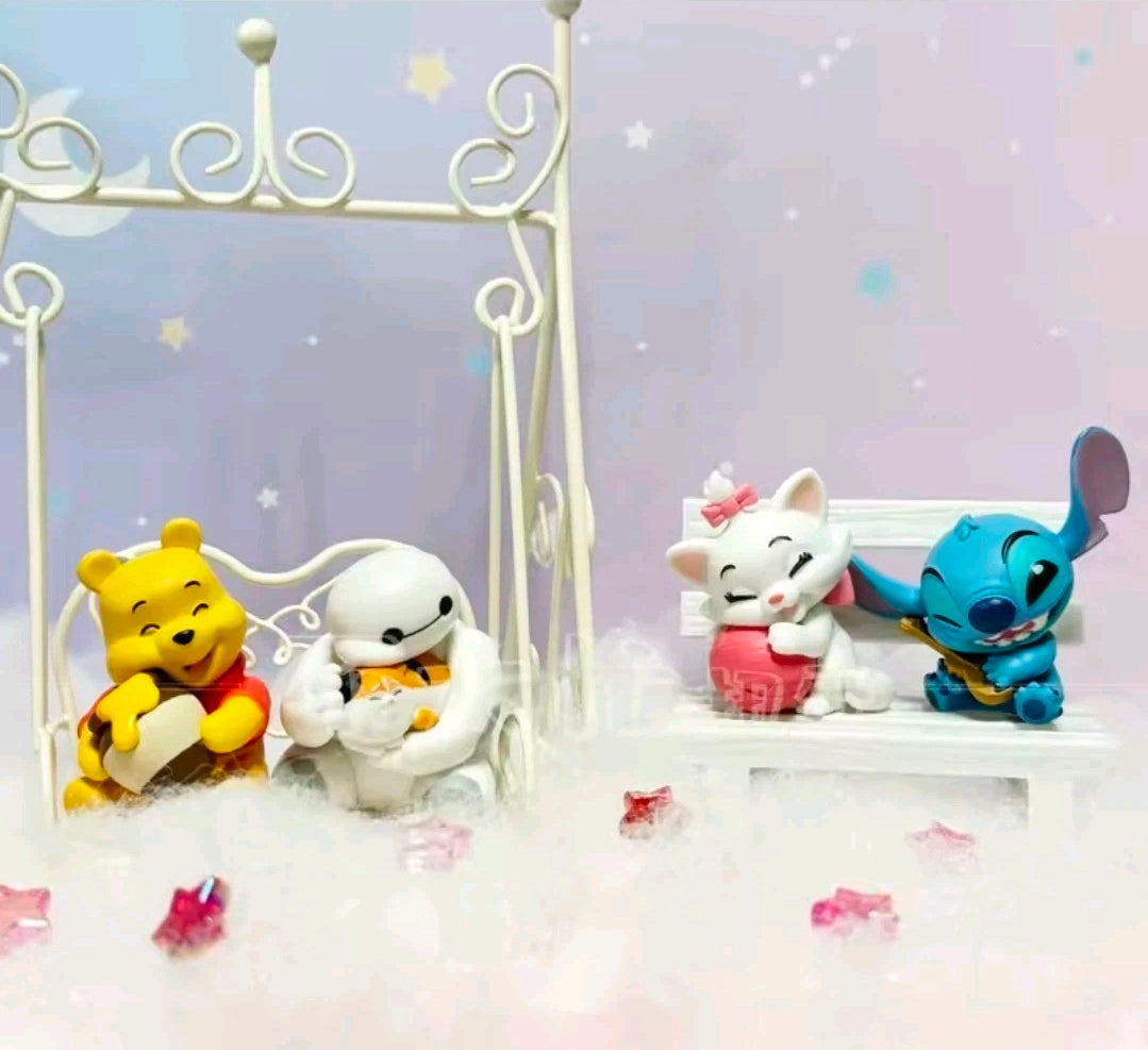 Four Disney plush figures posed on a small display stand: Stitch, Pooh, white robot, Marie