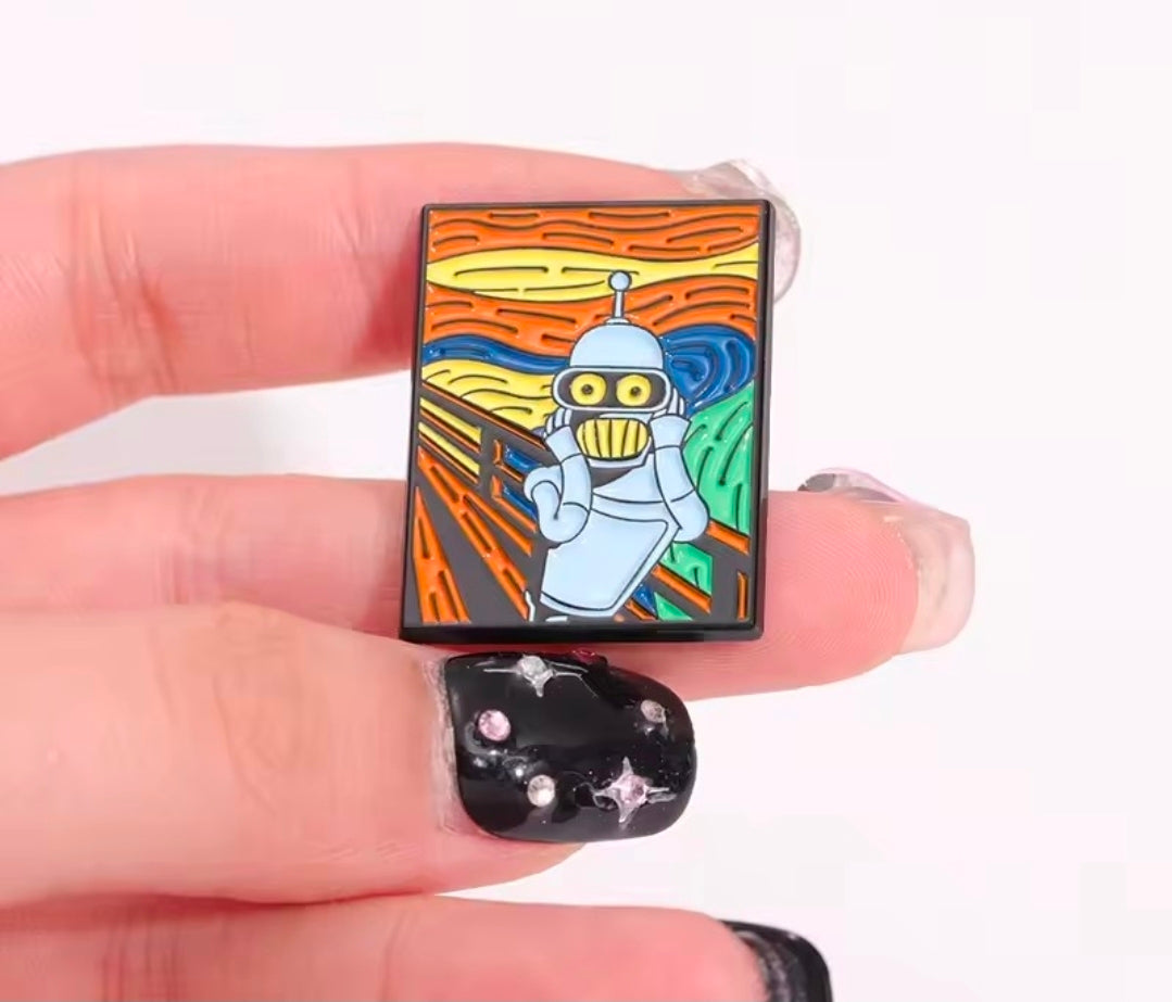 Square enamel pin held in hand, featuring blue robot in orange swirl artwork
