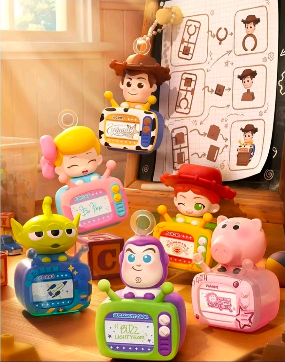Toy Story TV-shaped character phone mounts featuring Woody, Buzz, Alien, and other figures