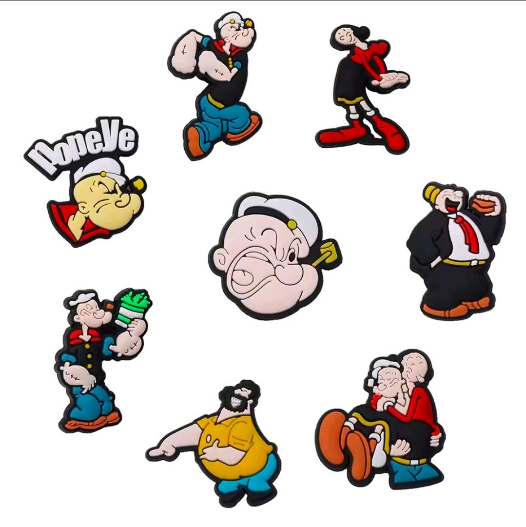 PVC shoe bag charm set with assorted Popeye character charms on a white background