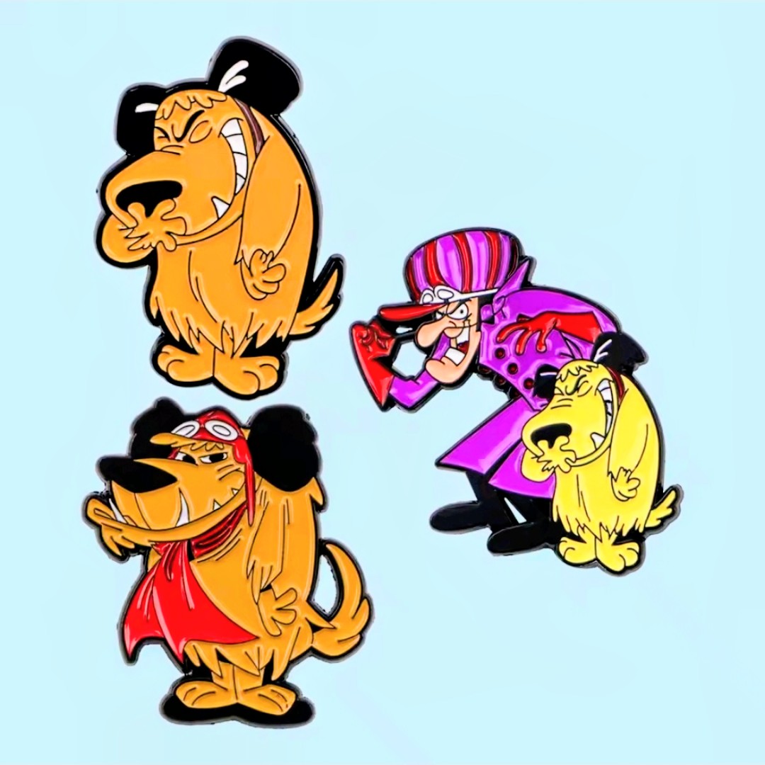 Three character enamel pins: two orange dogs and one purple hat character