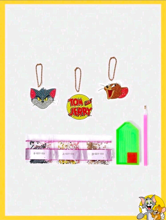 Diamond painting keychain kit with Tom and Jerry charms, bead strands, green tray and pink stylus