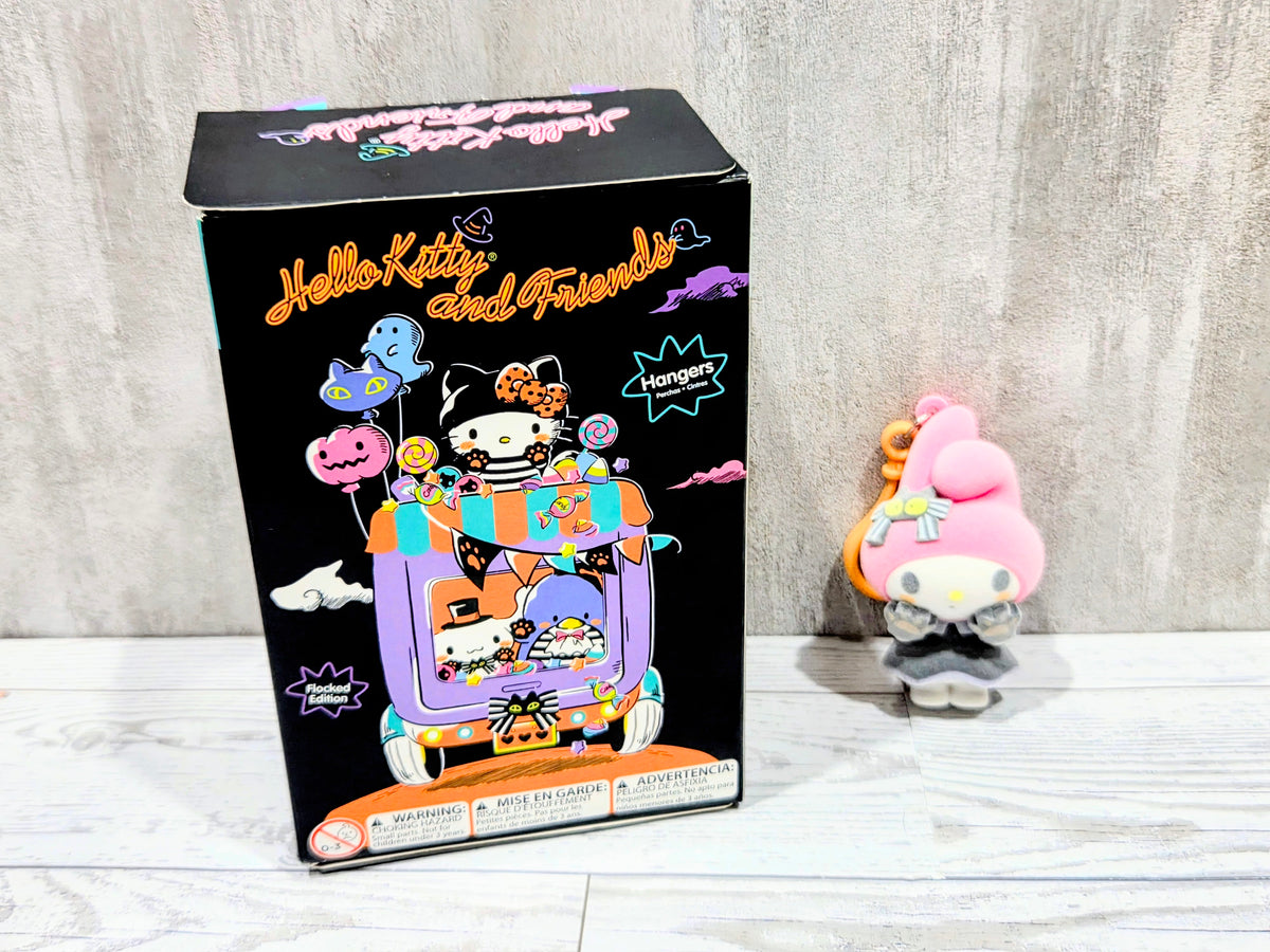 My Melody Halloween flocked hanger bag clip plush beside boxed packaging, orange loop