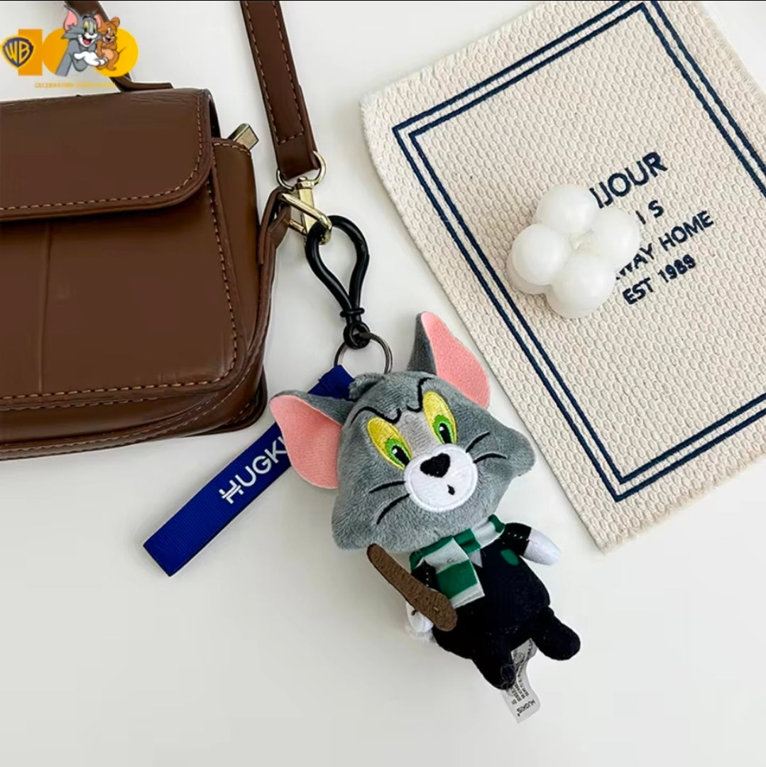 Grey wizard cat plush keychain with blue strap, green eyes, and brown wand on a ring