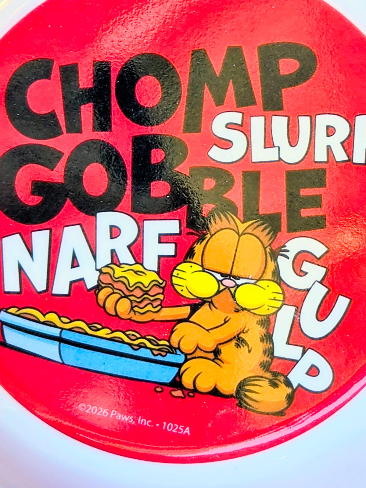 Red Garfield pet bowl lid with “CHOMP SLURP GOBBLE” text and Garfield artwork