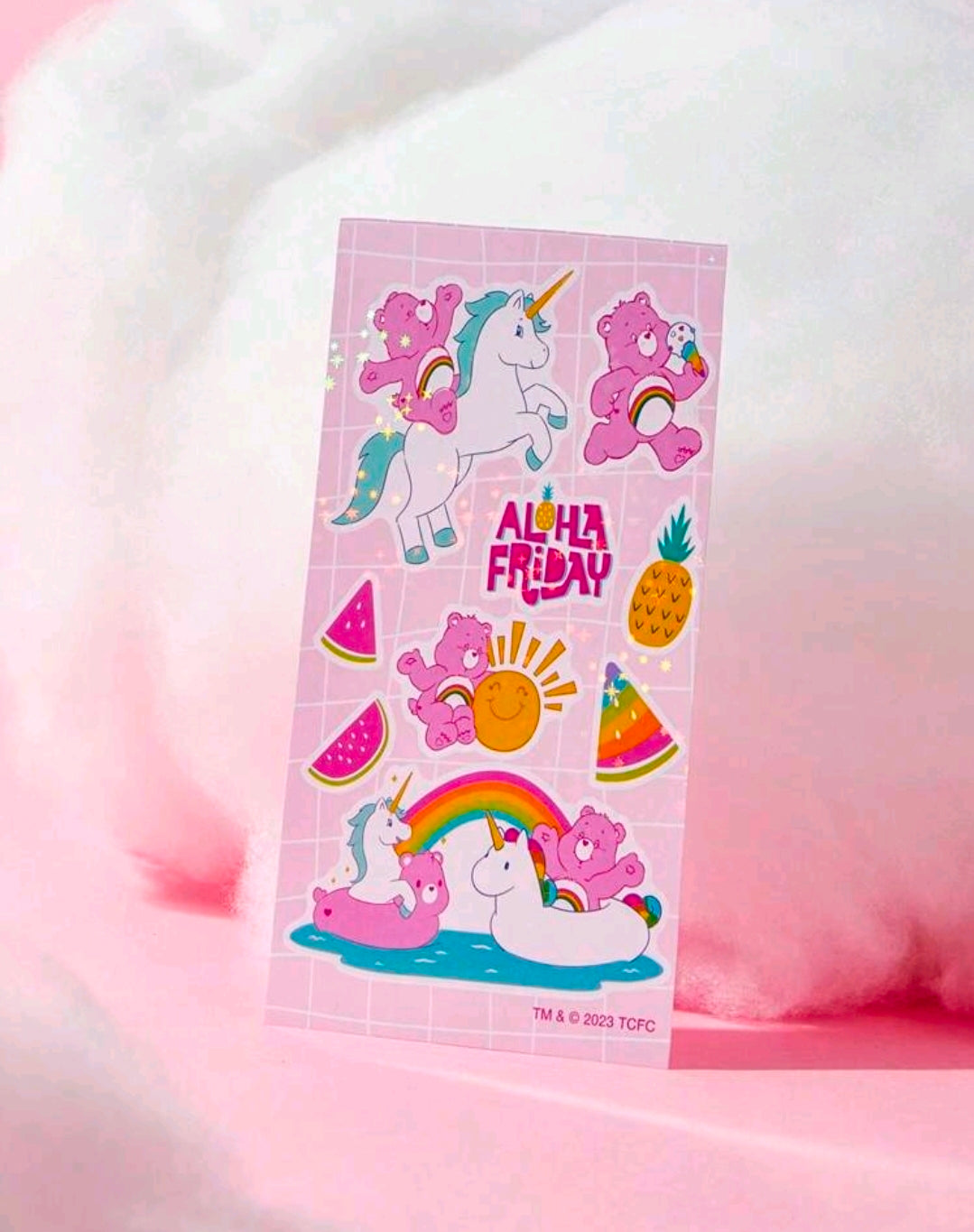 Holographic sticker sheet with unicorns, Care Bears, pineapples, and watermelon slices