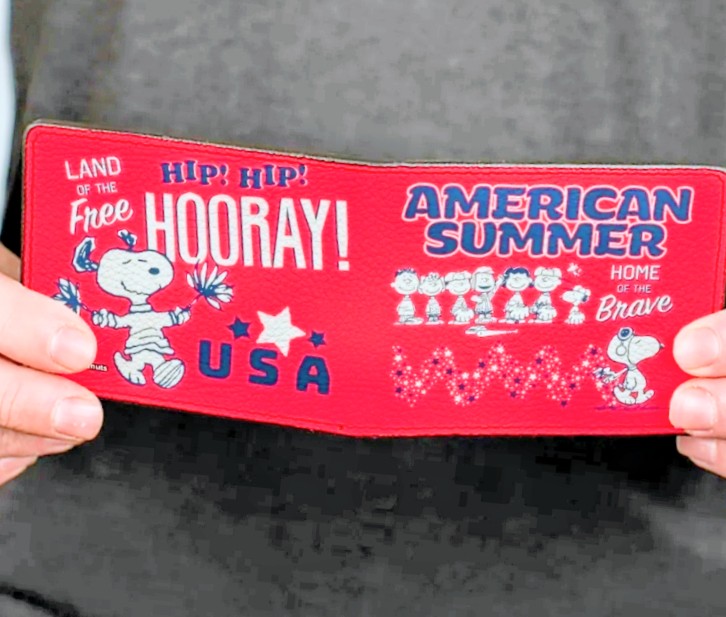 Red wallet front with American Summer title and Snoopy characters.