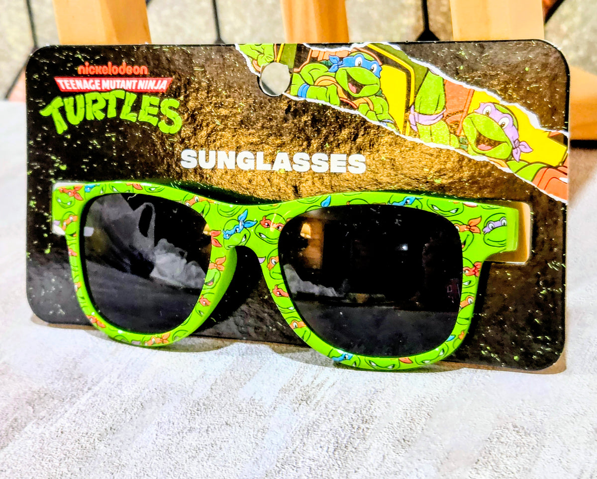 Teenage Mutant Ninja Turtles sunglasses in a box with green printed frames