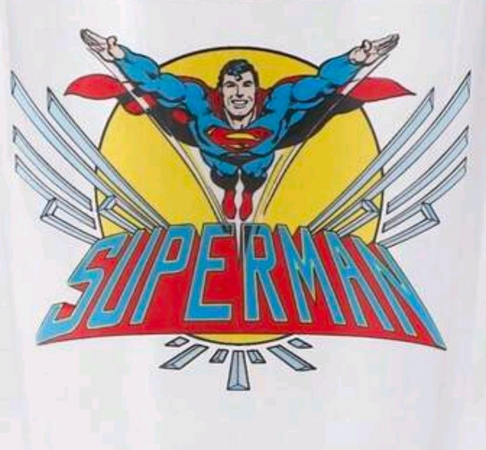 Superman emblem on clear tumbler mug with black lid.