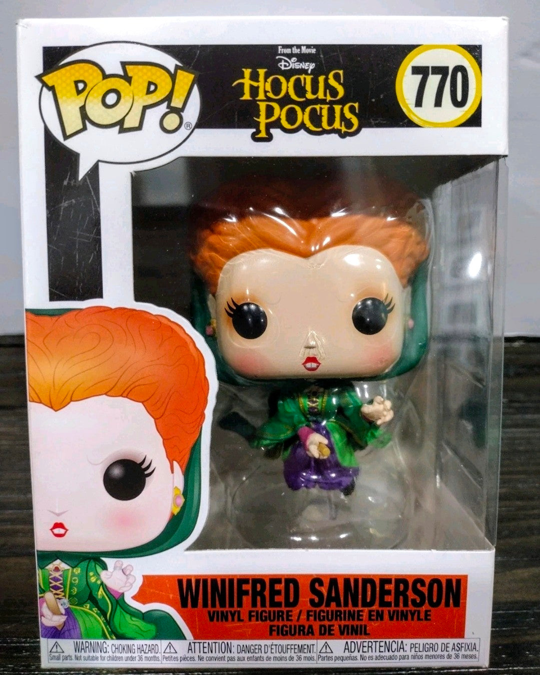 Boxed Funko Pop vinyl figure of Winifred Sanderson, orange hair, green outfit, purple skirt