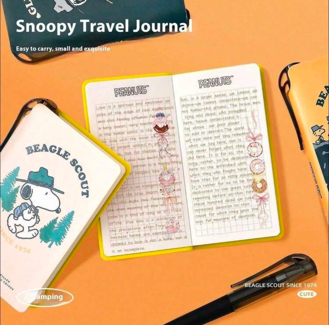 Snoopy Beagle Scout field notebook open with illustrated pages and interior card pockets