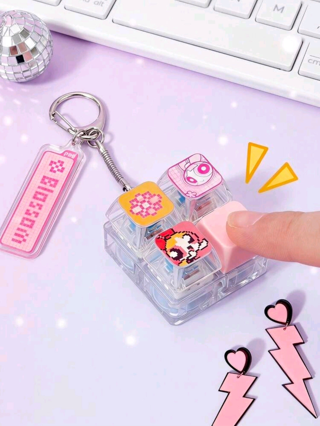 Keyboard clicker fidget keychain with translucent blocks, character face, metal ring