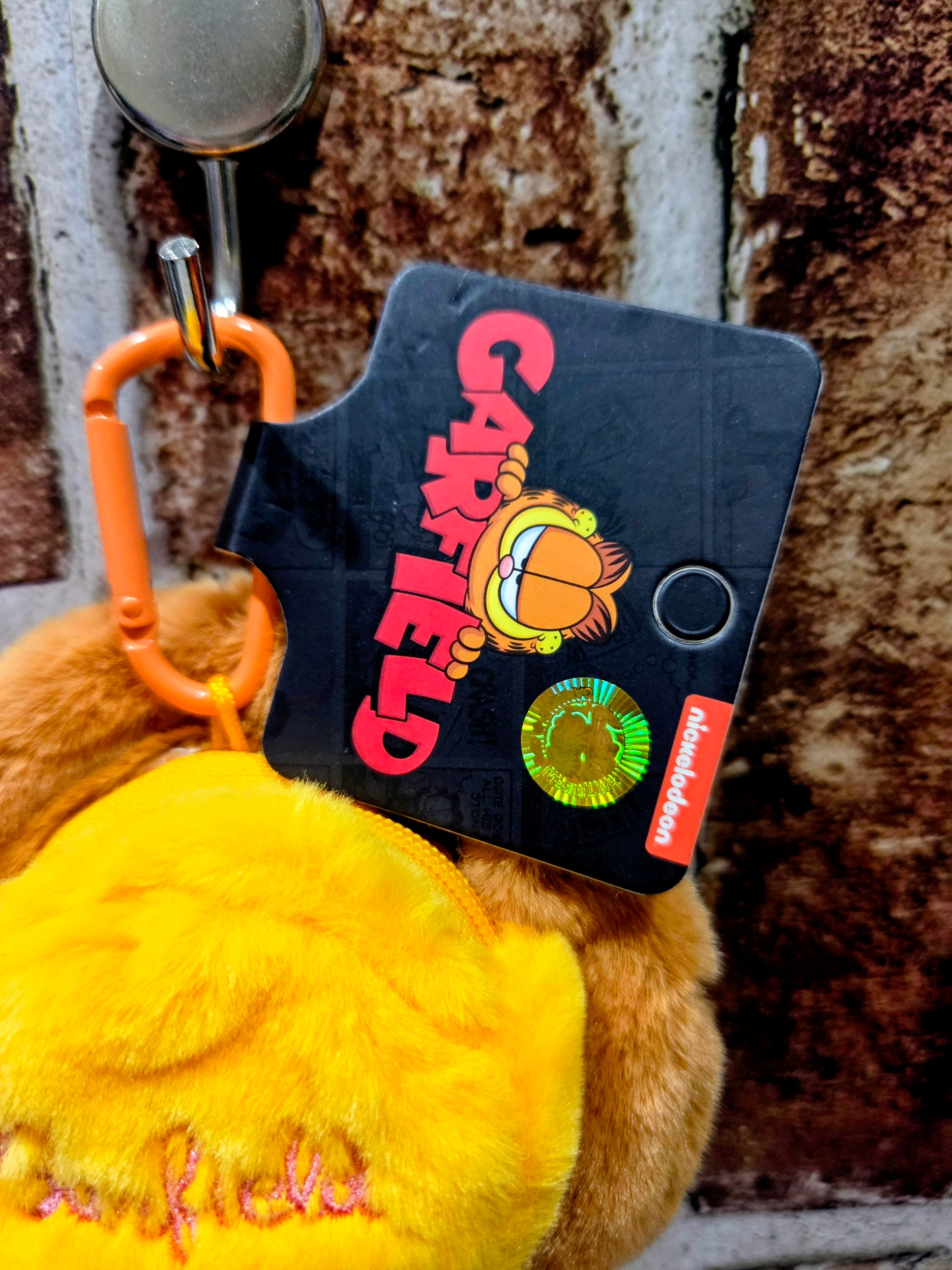 Garfield pizza plush coin pouch with orange handle and black card back