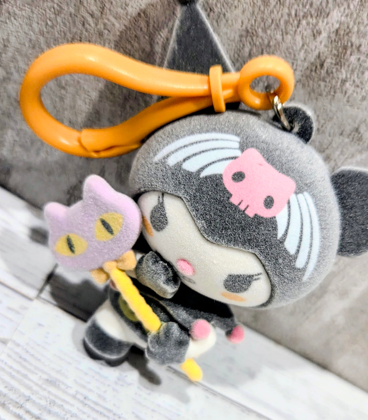 Kuromi plush bag clip with orange loop and yellow wand accessory