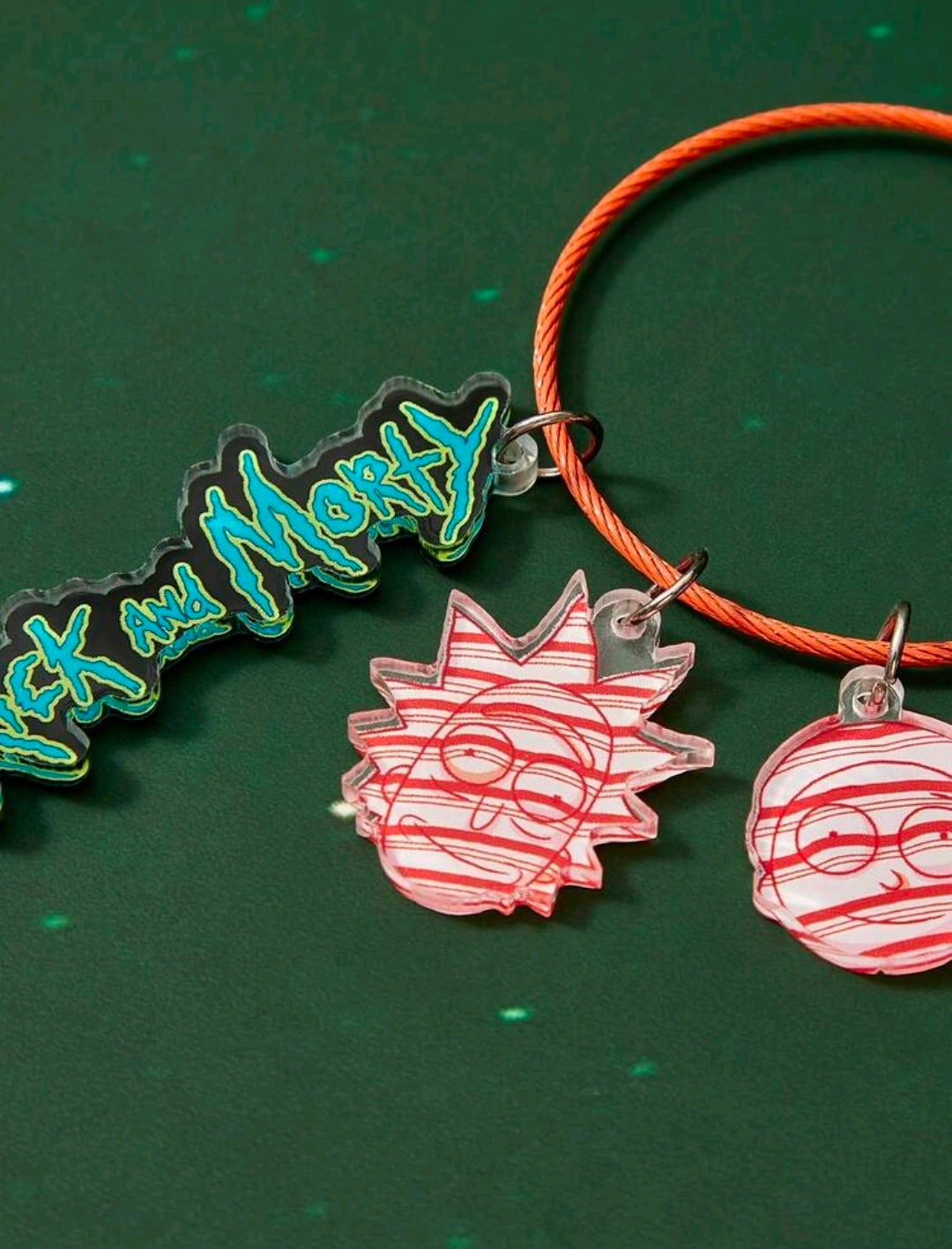 Braided orange wire keyring with blue Rick charm and red acrylic face charms