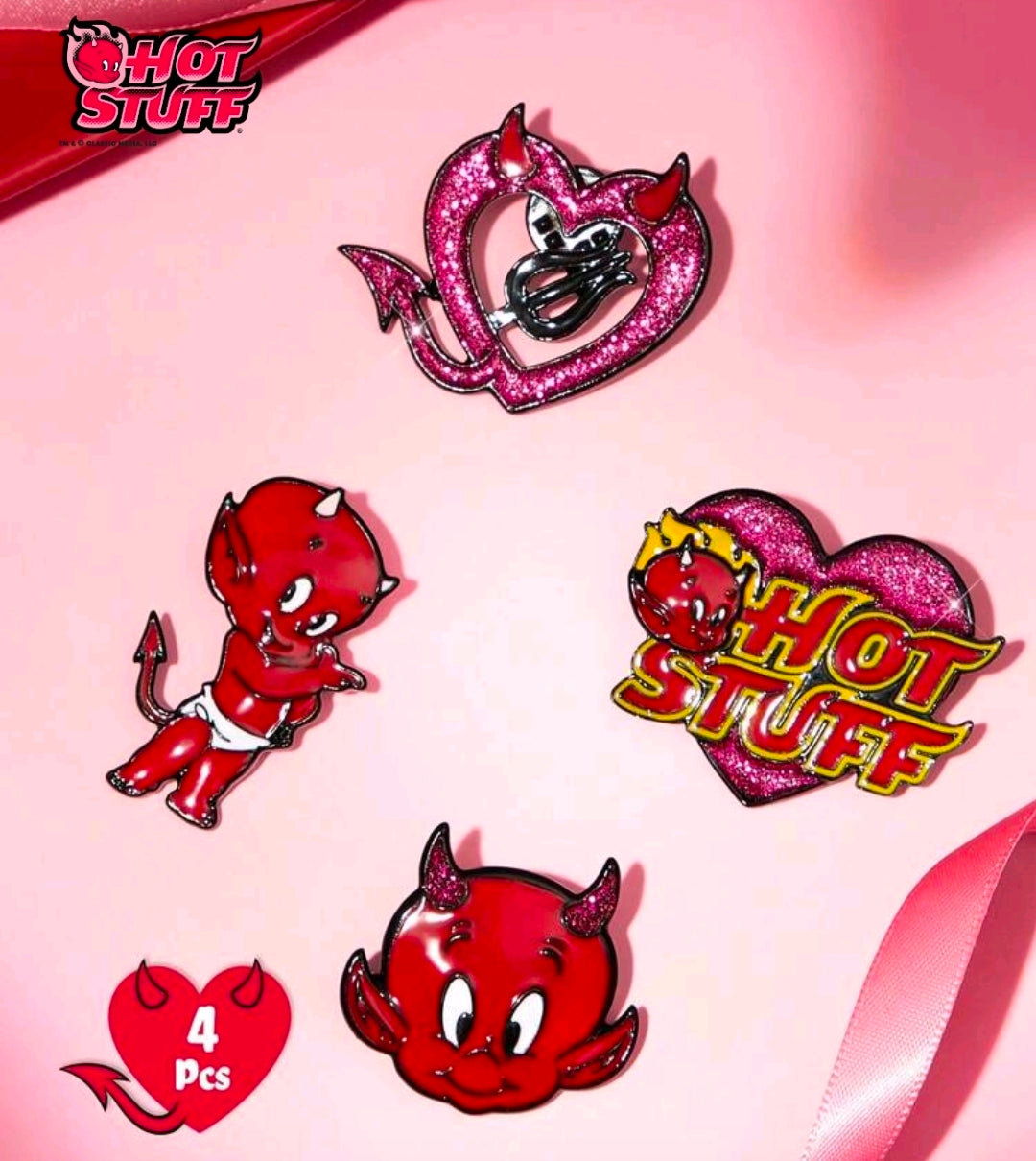 Four enamel pins: red devil character pins and pink glitter 'Hot Stuff' heart logo