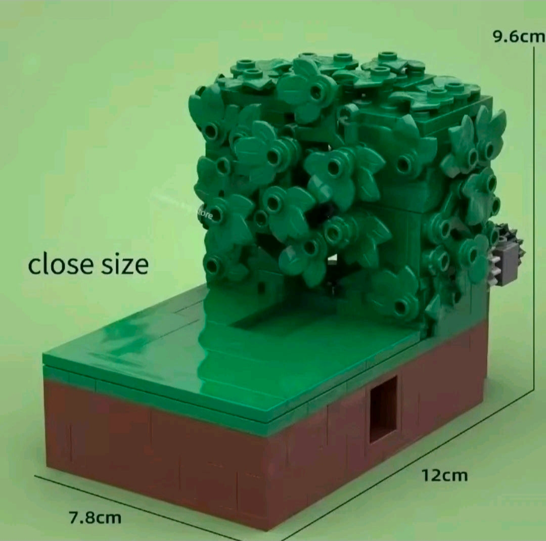 Compact brick model with dense dark green top canopy, brown platform base, side gear details.