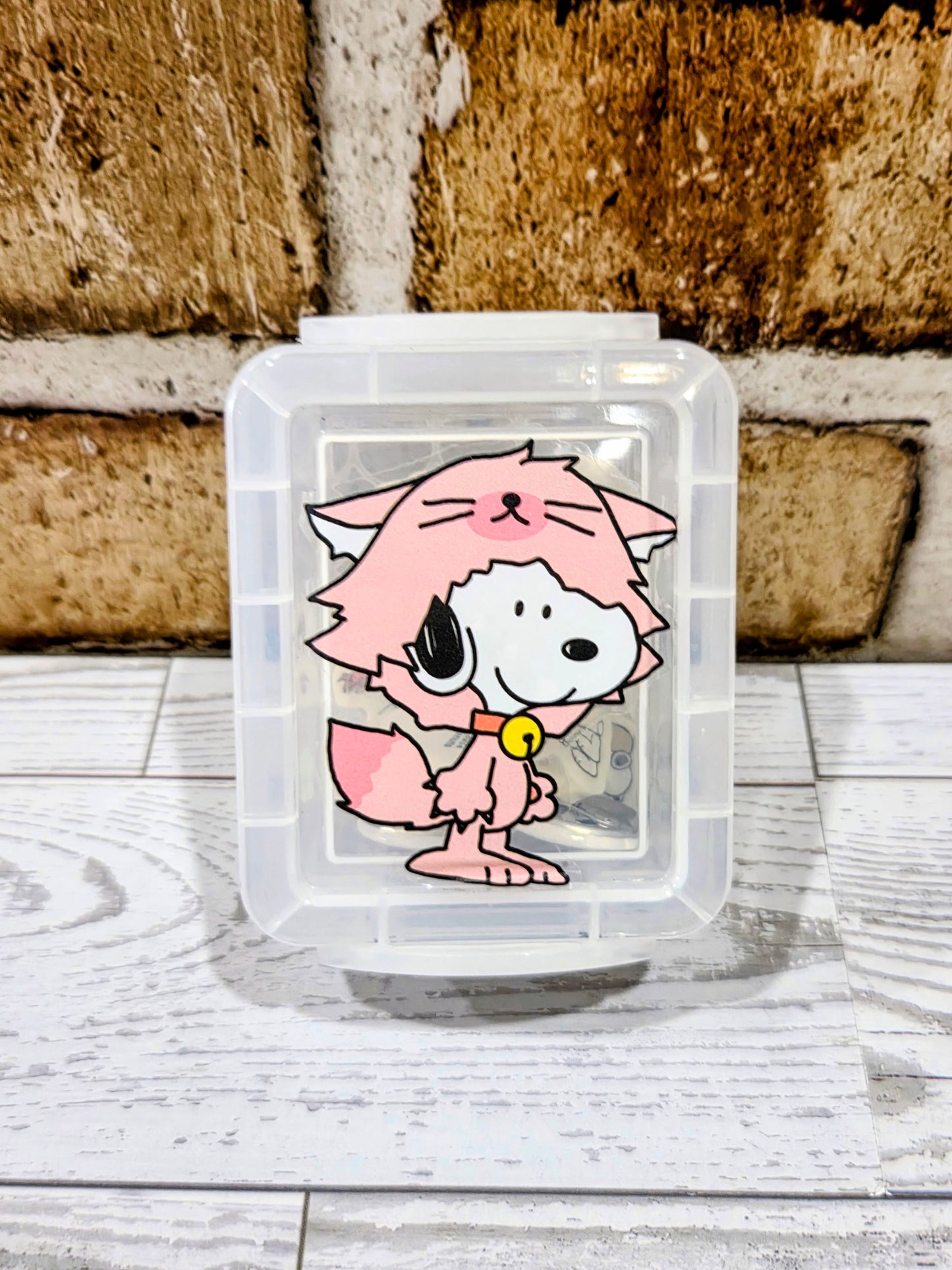 Clear mini organizer box with Pink Snoopy character graphic front, erasers inside
